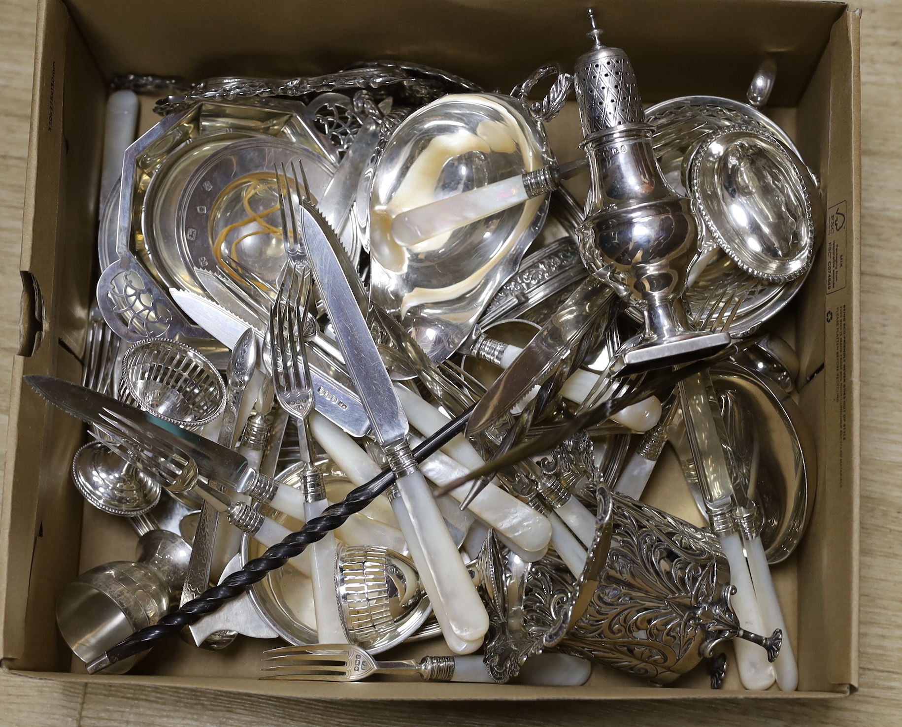 A mixed collection of small silver items to include various dishes, quaichs, pierced dishes, Georgian toddy ladles, egg cups, mixed cutlery, George III pepperette, sauceboat, stamp case, Dutch white metal box, twelve pai